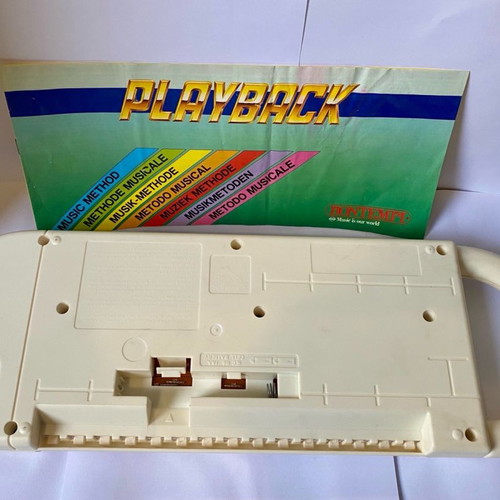 Vintage children's keyboard used with song booklet