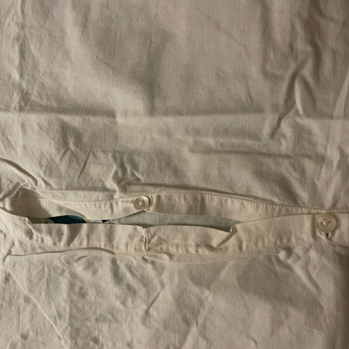 Pillowcase with cutwork embroidery used, button closure