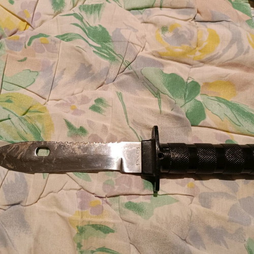 Survival knife used with needles, threads and compass