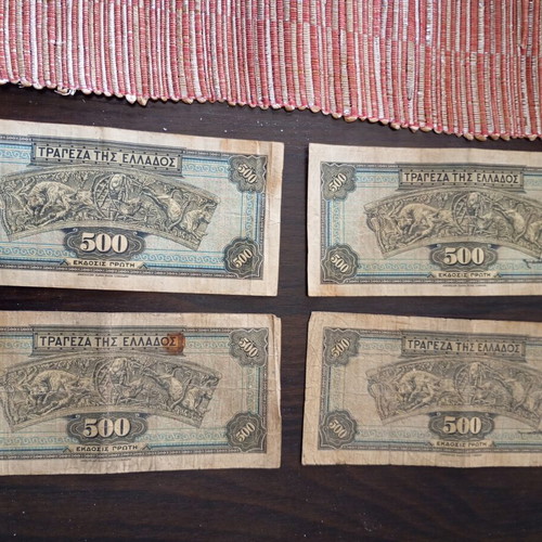 Old collectible banknotes used, 7 of 1000 drachmas and 4 of 500 drachmas