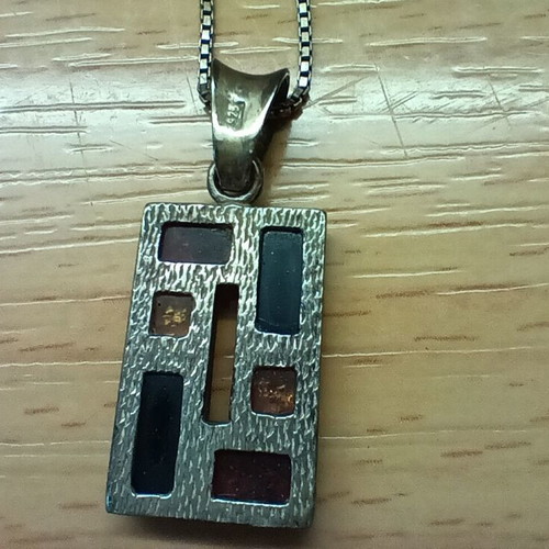 Silver pendant with Baltic amber like new