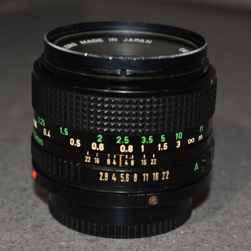 Canon A-1 collectible pack like new with Motor Drive, strap and 35mm f/2.8, 135mm lenses