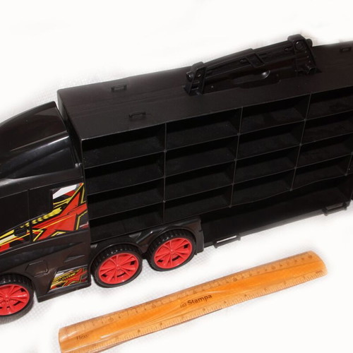 Large plastic truck used with compartments and handle
