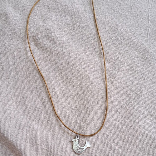 Vally Kontidis Silver Bird Necklace on Ecru Cord like new