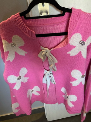 Pink cardigan one size like new with bows and rhinestones