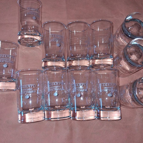Set of 12 glass tsipouro glasses "ΟΙΚΟΓΕΝΕΙΑΣ ΑΠΟΣΤΟΛΑΚΗ" like new