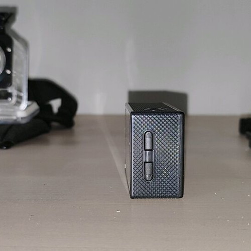 Action camera like new with waterproof case and mounting accessories