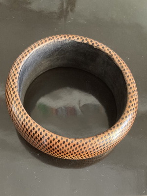 Vintage wooden bangle bracelet with dotted geometric pattern