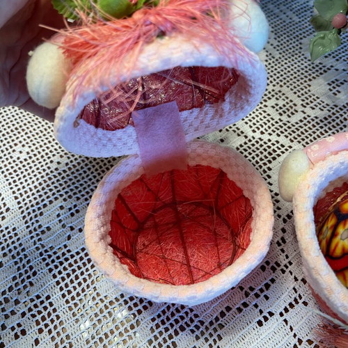 Easter decorations used, pink wicker baskets with rabbit and candle eggs