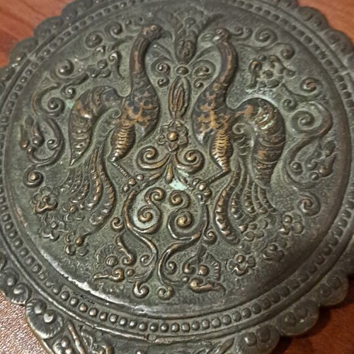 Brass hand mirror used with embossed peacock decoration