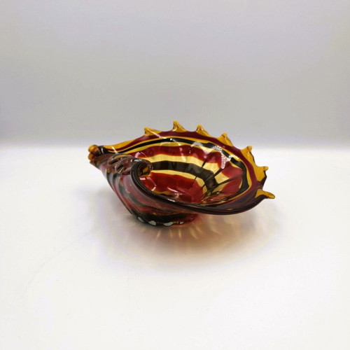 Glass ashtray used red with shell design