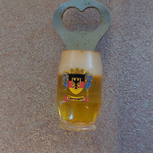 Decorative bottle opener used with wear around the magnet