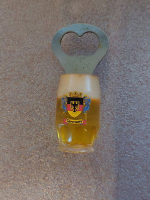 Decorative bottle opener used with wear around the magnet