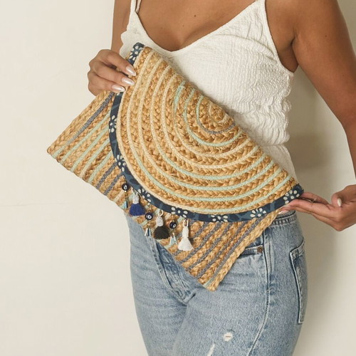 Woven clutch bag with ornamental details