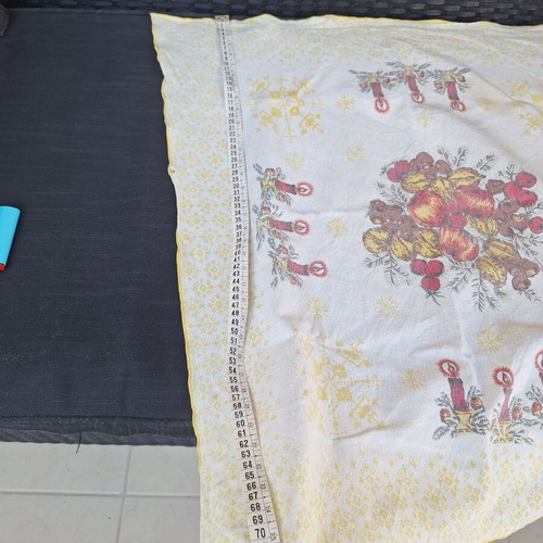 Small tablecloth with candles and fruit used