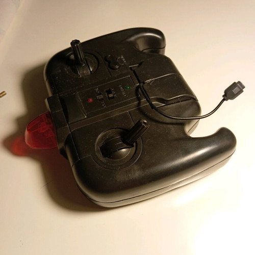 Remote control helicopter used, non-working with controller and 3 extra blades