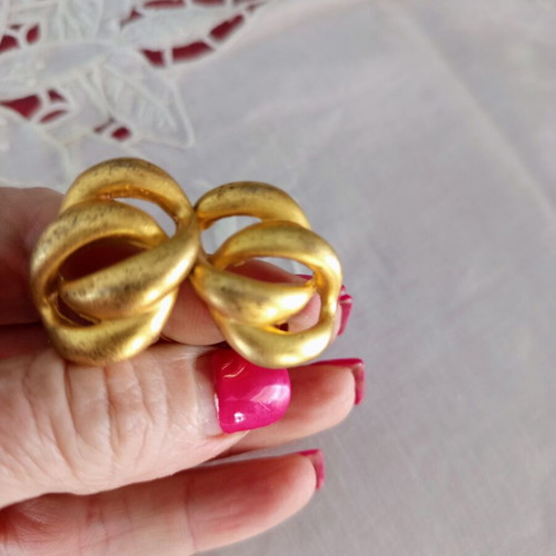 Clip-on earrings used, relief design, bronze tone