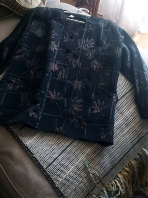 Jacket large with subtle bronze bow for formal occasions