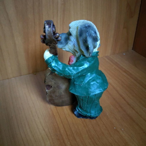 Decorative dog figure with cello like new