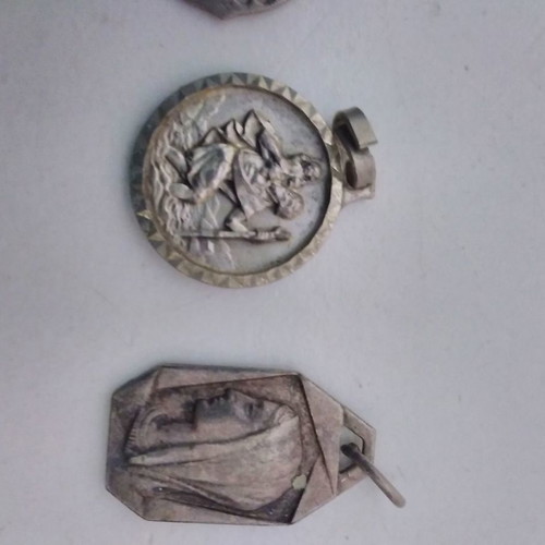 Silver pendant necklace used with zodiac and catholic figures