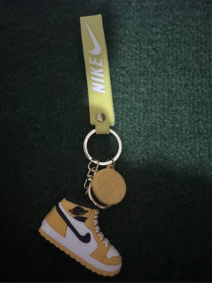 Nike shoe keychain, yellow