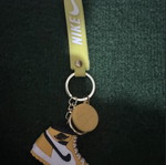 Nike shoe keychain, yellow