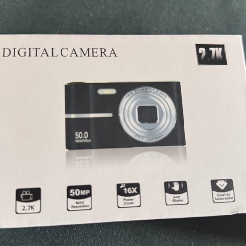 Digital camera used with velvet case, cable, battery, and strap