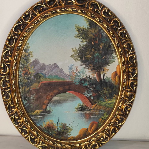 Oval vintage painting on canvas with golden frame used
