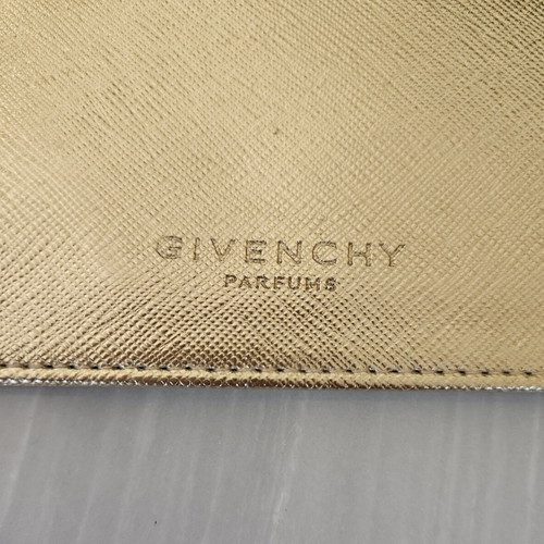 Givenchy pouch like new, gold