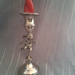 Vintage candlestick with cherub figure