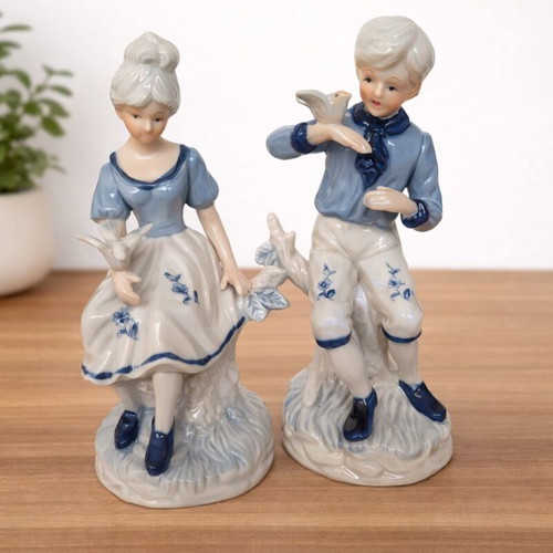 Vintage decorative figurines of boy and girl like new, 19 cm tall