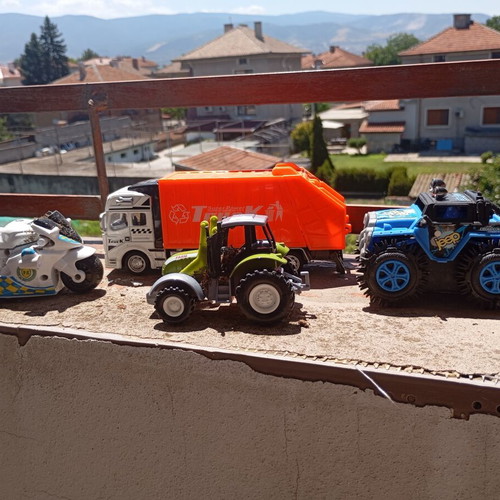 Lot of 4 used medium-sized children's toy vehicles