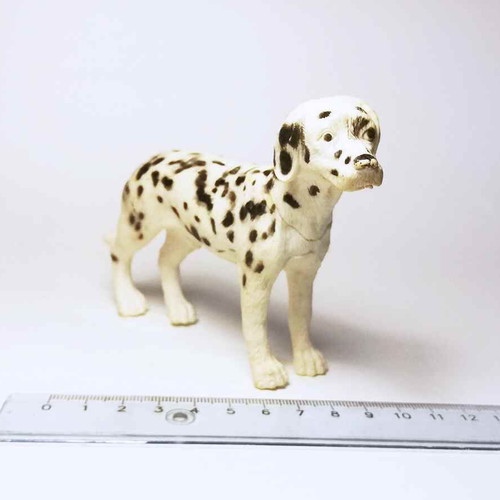 Plastic dog figure used with marks and scratches