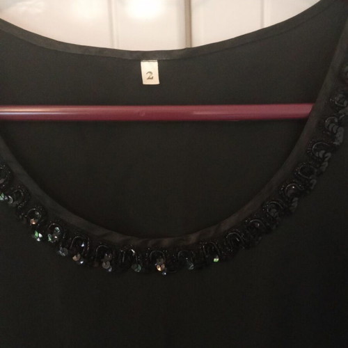 Black top with sequin detail like new