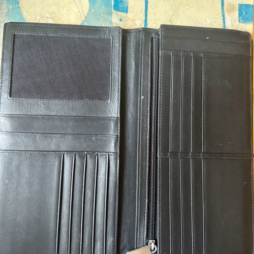 Large leather wallet used with multiple compartments, black