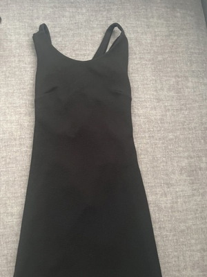 Black mini dress Caramella like new, size Medium with crisscross details