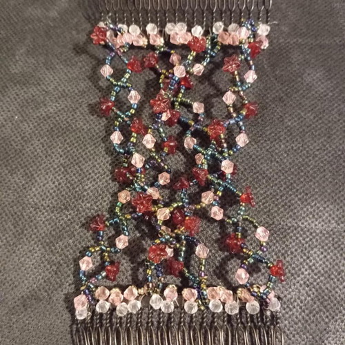 Hair comb like new with red, pink, black and transparent beads