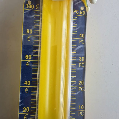 Vintage clown coin bank with yellow coin tube