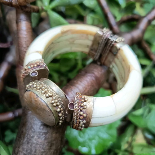 Boho bracelet used with bronze details beige
