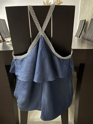 Denim top with crossback straps and ruffles, blue