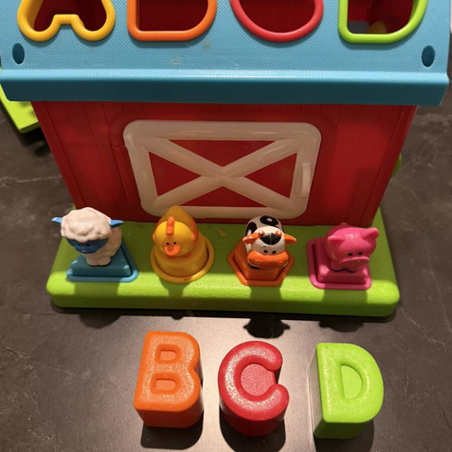 Baby learning toy used, missing one letter (M)