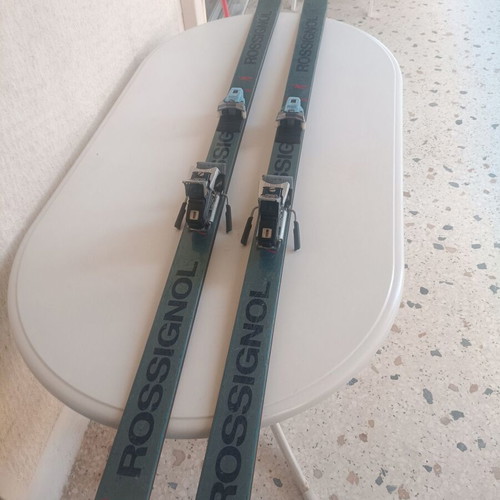Rossignol STS Fibroplastic skis used with Tyrolia 260 bindings, Skitique poles, and Solomon SX81 325 boots