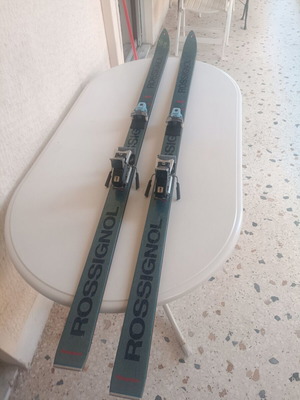 Rossignol STS Fibroplastic skis used with Tyrolia 260 bindings, Skitique poles, and Solomon SX81 325 boots