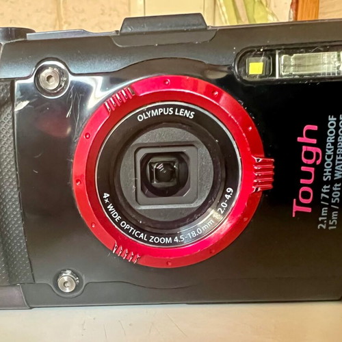 Olympus Tough GPS Camera like new with housing, torch, and base