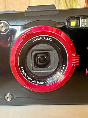 Olympus Tough GPS Camera like new with housing, torch, and base