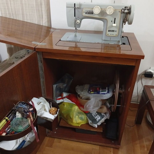 Russian Chaika Sewing Machine used with cabinet and accessories