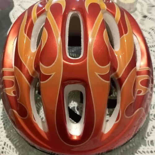 Children's helmet for bike and scooter used, medium size, red with orange flames