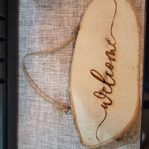 Wooden welcome sign from natural log new