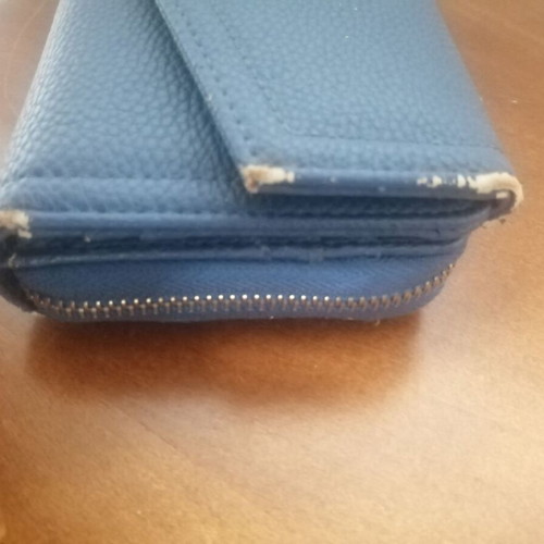KEM wallet used, blue with multiple compartments