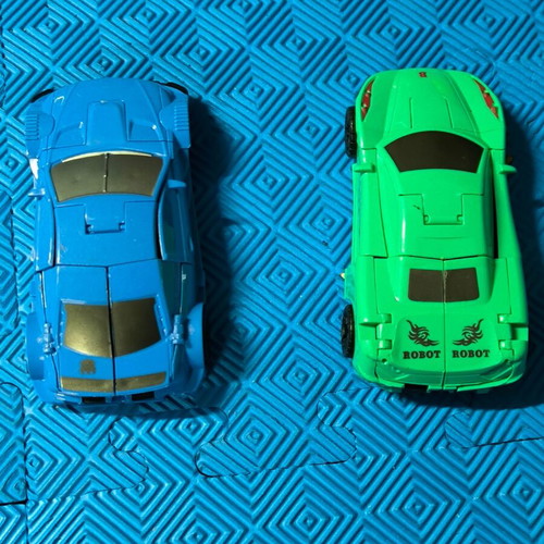 Robot Cars set of 2 like new, blue and green toy cars